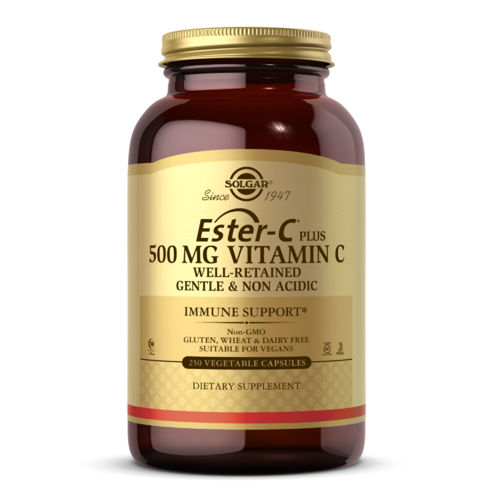 An amber glass bottle of Solgar's Ester-C Plus 500mg Vitamin C Vegetable Capsules on a white backdrop.